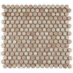 a white and brown mosaic tile with circles on the back ground, in various sizes