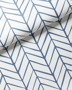 a white and blue wallpaper with an abstract pattern on it's surface,