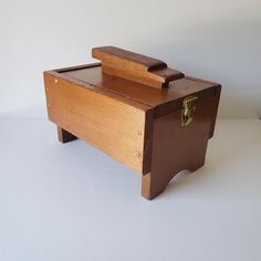 a small wooden box sitting on top of a table