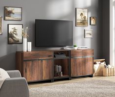 a flat screen tv mounted to the side of a wooden cabinet in a living room