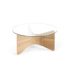 an oval glass coffee table with wooden legs and a curved design on the top, in front of a white background