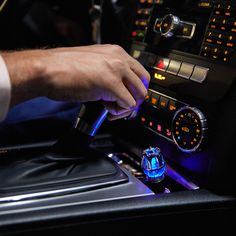 a man is working on the radio in his car