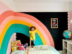 Here’s How I Created a Spectacular $50 Rainbow Mural in My Daughter’s Room | Cubby Rainbow Wall Mural Diy, Boy Rainbow Room, Rainbow Kids Bedroom, Wall Mural Diy, Wall Rainbow, Rainbow Wall Mural, Rainbow Mural, Rainbow Bedroom, Kids Room Murals