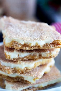 a stack of desserts sitting on top of a white plate