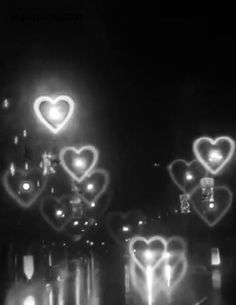 some lights that are in the dark with hearts on them