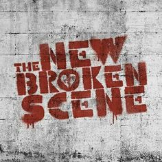 the new broken scene logo painted on a brick wall with red paint splattered over it