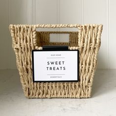 a wicker basket with a sign that says sweet treats