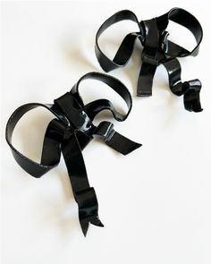 These lightweight Bow Earrings from Collection by Rin are the perfect addition to your look this holiday season. These classic bows are a chic, statement-making design that's handcrafted with originality. Stainless steel earring posts. Slight variation will occur between pairs due to the handmade nature. Handmade using polymer clay. Black Bow Earrings For Gift, Black Bow Earrings For A Gift, Black Bow Earrings As Gift, Adjustable Clip-on Party Earrings, Modern Adjustable Earrings For Party, Unique Handcrafted Jewelry, Earring Posts, Bow Earrings, Stainless Steel Earrings