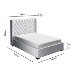 the bed frame is upholstered and has buttons on each side, along with an attached headboard