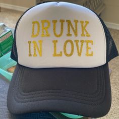 Drunk In Love Hat With Gold Shimmery Script. Never Worn Before Drunk In Love Hen Party, Drunk In Love Beyonce, Drunk In Love Bar Sign, Wedding Napkins Personalized Drunk In Love, Drunk In Love, Love Hat, Women Accessories, Black And White, Hats