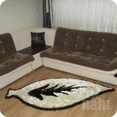 a living room with two couches and a rug