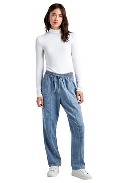 Every closet craves these drawstring-waist chambray pants that are both cool and comfortable. 15" leg opening; 9 1/2" front rise; 14 1/2" back rise Elastic/drawstring waist Five-pocket style 85% cotton, 14% linen, 1% elastane Machine wash, tumble dry Imported Versatile Denim Blue Bottoms With Elastic Waistband, Spring Tencel Bottoms With Elastic Waistband, Mid-rise Relaxed Fit Pants With Drawstring, Relaxed Fit Mid-rise Pants With Drawstring, Relaxed Fit Mid-rise Drawstring Pants, Casual Tencel Bottoms With Elastic Waistband, Denim Blue Pull-on Bottoms For Everyday, Everyday Denim Blue Pull-on Bottoms, Spring Utility Jeans With Elastic Waistband