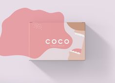 a pink box with the word coco on it and an image of a woman's face