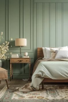 a bedroom with green painted walls and a bed in the middle, along with a chair