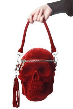 Welcome our newest skull member, in lush blood-velvet coating! The 'Grave Digger' handbag is yer creepy must-have - large human skull handbag - with intricate detailing, zip opening, long shoulder strap and detachable tassel detail. All Hail the Halloween Queen! Shop Now at KILLSTAR.com. Skull Handbags, Skull Purse, Skull Bags, Grave Digger, Skeleton Head, Halloween Queen, Velvet Purse, Red Skull, Red Flannel