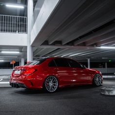 a red car parked in a parking garage