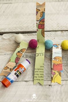 winnie the pooh bookmark craft with crayon markers and felt balls on top