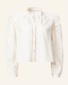 Crafted from cotton, our white eyelet shirt has long puffed sleeves and a ruffled collar. Eyeleted with diamond-shaped designs, the shirt has a mother-of-pearl button front and hand embroidery. If you love the Annabel, try the Winnie Shirt, which is the same cut with short sleeves. This one-of-a-kind textile was embroidered by hand. Subtle variations are part of the unique beauty of the garment and a signature of the artisan's hand. Scout Guide, Eyelet Shirt, The Scout, Ruffled Collar, French Seam, White Eyelet, Long Puff Sleeves, Spring Tops, Puffed Sleeves