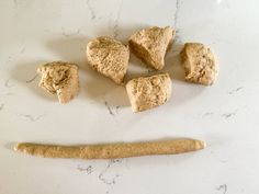 some food is laying out on the counter next to it's bone and bones