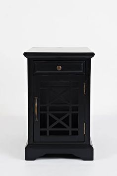 a small black cabinet sitting on top of a white floor