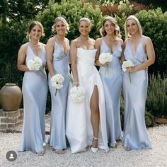 a group of women standing next to each other