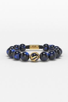 Embrace the power of self-liberation with the Waves Bracelet. This 12mm design, featuring a unique wave pattern encircling a captive ball, symbolizes the mental boundaries we often impose on ourselves. It serves as a constant reminder that the limits we face are often of our own making, and it is within our power to transcend them. Each glance at your wrist with this bracelet will inspire you to unlock your true potential and break free from self-imposed constraints. All our stones are chosen by hand to satisfy AAA quality standards. They are natural stones and their size and color can vary slightly. Stone: AAA Grade 12mm Metal: 925 Solid Sterling Silver Links / 24k Gold Plated / Rhodium over 925 Sterling Silver 100% Handcrafted Package: High quality velvet pouches Luxury Blue Beaded Bracelets, Luxury Blue Bracelets With Natural Stones, Luxury Blue Bracelet With Natural Stones, Luxury Blue Round Bead Bracelets, Modern Bracelets With Natural Stones, Modern Natural Stone Round Bracelets, Luxury 8mm Beaded Bracelets, Mental Boundaries, Waves Bracelet