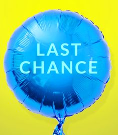 a blue balloon with the words last chance written on it in front of a yellow background