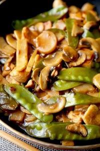 mushrooms and green beans are in a bowl