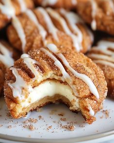 a white plate topped with donuts covered in icing