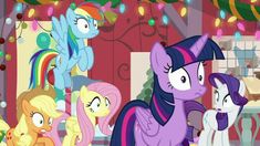 several ponies are standing in front of a christmas tree with lights hanging from the ceiling