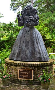 a statue of a woman in a long dress