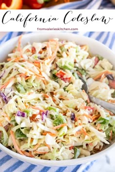 a white bowl filled with coleslaw slaw next to a blue and white striped table cloth