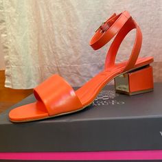 New In Box! Vince Camuto Block Heel Sandal. Orange Leather With Gold Details. Buckle Closure. Cushioned Foot Bed. 2" High Heel. Orange Block Heel Sandals For Evening, Evening Orange Sandals With Heel Strap, Orange Ankle Strap Heels With Stacked Heel, Chic Orange Open Toe Sandals, Formal Orange Ankle Strap Sandals, Orange Low Heel Sandals For Summer, Orange Leather Sandals With Low Heel, Orange Leather Low Heel Sandals, Orange Low Heel Leather Sandals