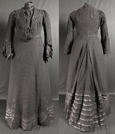 A stylish Edwardian antique fashion mourning dress, dating to the early 1900s, mostly in very good condition. Two pieces, in black silk overlayed with a black silk textile with a textured lattice open weave. The bodice is fitted and boned (with more of a 'regular' silhouette than many antique pieces..) , the silk underbodice fastening at center front with hooks. Over this a silk neck piece fastens to one side with hooks, gathered vertically, with applied decoration running down the centre. The n Victorian Style Black Evening Dress, Black Victorian Dress With Historical Design, Victorian Style Black Costume Dress, Black Victorian Costume Dress, Black Victorian Dress With Long Sleeves, Black Victorian Evening Dress, Regency Style Black Evening Dress, Black Regency Style Evening Dress, Black Victorian Wedding Dress With Lace Trim