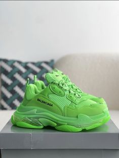 Turn heads and break boundaries with these neon green Balenciaga Triple S-inspired sneakers. The electrifying colorway and signature chunky sole make a bold statement, while the premium materials ensure lasting comfort. Embrace the avant-garde and step into the future of footwear. Trendy Green High-top Platform Sneakers, Green Lace-up Platform Sneakers With Contrast Sole, Functional Green Sneakers With Abzorb Midsole, Green Sporty Platform Sneakers With Round Toe, Modern Green Sneakers For Spring, Trendy Green Sneakers, Green Lace-up Chunky Sneakers For Streetwear, Green High-top Platform Sneakers With Rubber Sole, Trendy Green Chunky Sneakers With Round Toe