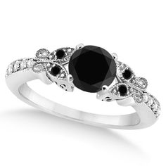 a black and white diamond engagement ring on a white background with diamonds around the band