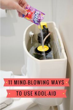 a person is pouring water into a toilet with the lid up and holding a candy bar in their hand