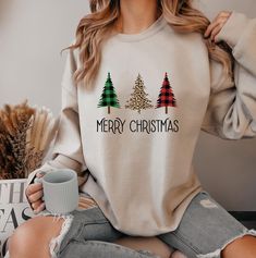 Embrace the holiday spirit with our cozy Merry Christmas Sweatshirt, the perfect blend of comfort and festive cheer for your winter wardrobe. Crafted with soft, high-quality fabric, this Christmas Vacation Sweater is designed to keep you warm while you celebrate with family and friends, making it an ideal Christmas outfit for any gathering. Feel the joy and nostalgia of the season with every wear as you don this charming Christmas jumper, creating memories that sparkle just like the lights on yo Coffee Sweatshirt, Merry Christmas Shirts, Sweatshirt Christmas, Christmas Coffee, Holiday Shirts, Retro Christmas, Christmas Women, Christmas Dog, Christmas Shirt