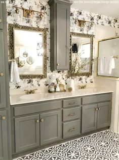 a bathroom with two sinks and mirrors on the wall next to each other in it