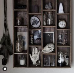 a wooden shelf filled with lots of different items