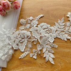 white lace with flowers on a wooden table