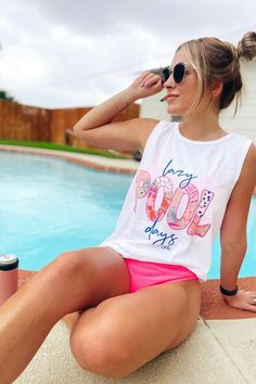 ☀️lazy POOL days☀️ *zoom in to see the “pool” print details!!! 😍😍😍” 👉🏼7 color screenprinted design on a unisex, White, soft spun cotton tank. Malloree is 5’7” for reference, and is wearing a medium. It covers her booty! These run true to size, more on relaxed side and work great as a coverup. Swim Cover Up Outfit, Pool Styles, Lazy Pool, Summer Tank Top Outfits, Beach Tanks Tops, Swim Season, Beach Tanks, Pool Fashion, Tanks Tops