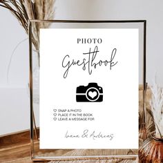 a photo frame with the words guest book on it