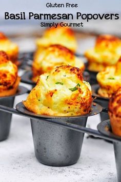 several small muffins sitting on top of each other in metal cups with the title, gluten free basil parmesan popovers simply gourmet