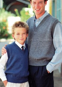 an older man and young boy posing for a photo