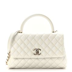 This is an authentic CHANEL Iridescent Caviar Quilted Small Coco Handle Flap in White. This stylish handbag is crafted of Iridescent diamond-stitched grained caviar leather in white. The shoulder bag features a rolled leather top handle, an optional shoulder strap, and a gold CC turn-lock closure. The flap opens to a partitioned beige leather interior with a zipper middle compartment, and additional pockets. Chanel Crossbody, Coco Handle, Chanel 19, Chanel Tweed, Chanel Caviar, Fall Fits, Chanel Bags, Clothing Ideas, Flap Bag