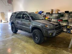 a gray toyota truck parked in a garage