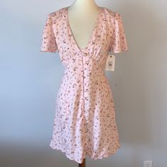 Billabong Pink Floral Button Down Dress . Brand New With Tags. Size Medium. Pink Floral Pattern Button Down Dress By Billabong. Short Sleeves. V Neckline. Tie Closure Along Backside Of Dress. Summer Dresses With Short Sleeves And Buttons, Summer V-neck Dress With Button Back, Summer Knee-length Mini Dress With Buttons, Summer Mini Dress With Short Sleeves And Buttons, Spring Vacation Mini Dress With Buttons, V-neck Button Back Summer Dress, Fitted Button-up Vacation Dress, Fitted Dresses With Buttons For Vacation, Fitted Buttoned Dresses For Vacation