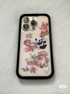 an iphone case with animals on it sitting on a white surface, showing the back cover