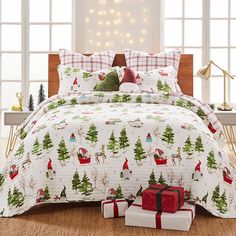 a christmas themed bed with presents on the floor